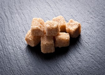  brown sugar cubes closeup.