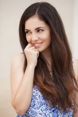 Happy young woman smiling outdoor portrait, pretty girl at street