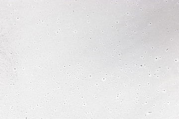 Water drops on glass background texture.