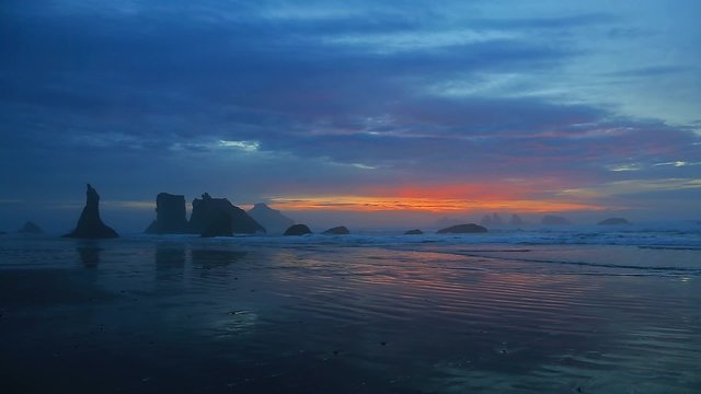 Sunset surf at Bandon Beach with seastacks, Oregon