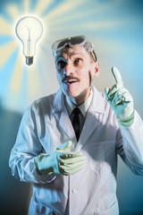 funny engineer inventor scientist looks and and raised his index finger