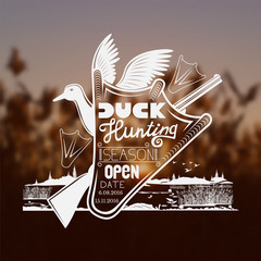 Duck silhouette on the river blurred landscape background. duck hunting season open lettering on duck footprint