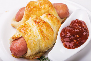 Homemade fresh sausage in the dough, close-up