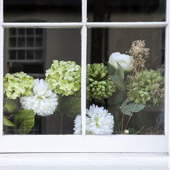 window wiith beautiful artificial  hydrangea