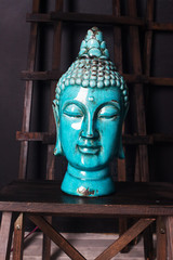 ceramic Buddha head old antique blue interior detail