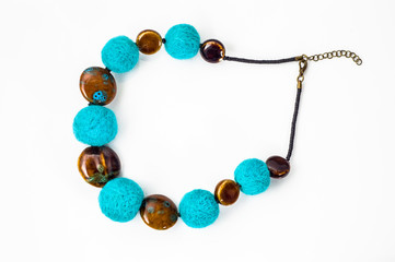Felt necklace. Handmade stylish felt jewelry isolated on white background