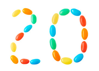 20 number made of multicolored candies isolated on white