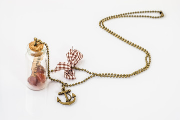 Pendant made with glass bottle, antique gold chain and amber iso