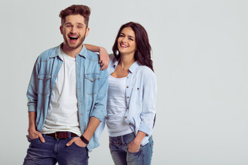 Fototapeta premium Beautiful young couple in jeans