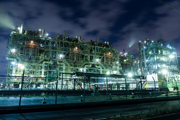 Oil refinery building industry at night