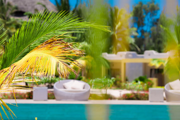 Fototapeta na wymiar Beautiful luxury umbrella beach and chair around swimming in hotel resort