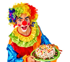 Happy birthday clown man keeps cake on plate.  Isolated.