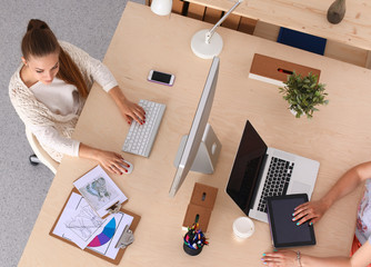 Fashion designers working in studio