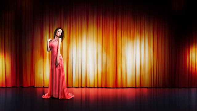 attraktive brünette junge Frau in langem Kleid auf einer Bühne