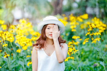 close up portrait of young asian women close her eyes buy her hands, bright colors, positive emotions, cheerful youth concept.