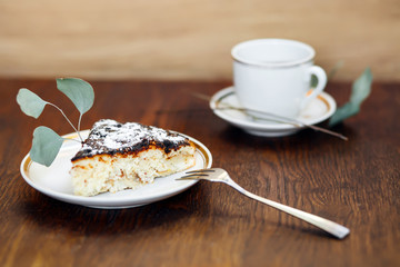 Piece of Easter cake on a wooden background.