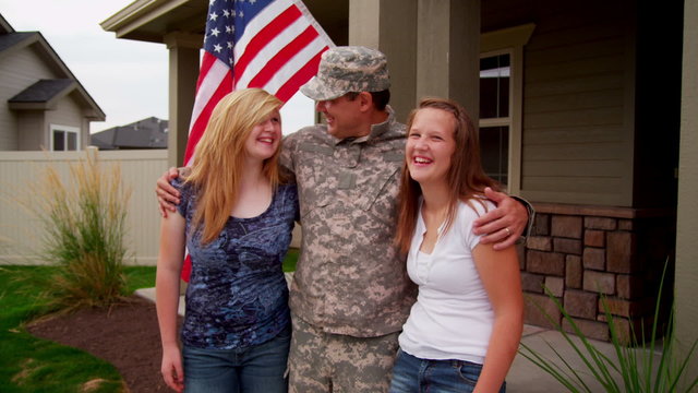 Military dad with daughters