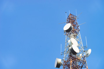 Telecommunication mast TV antennas with blue sky