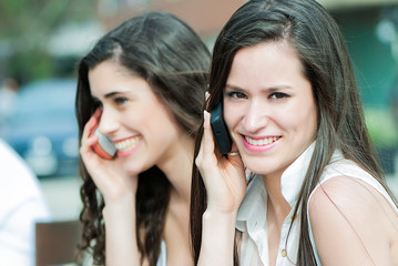 Portrait of a beautiful caucasian woman talking on the phone at