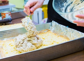 Close up of woman hands preparing sweet cake