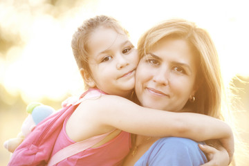 Mother and daughter embracing
