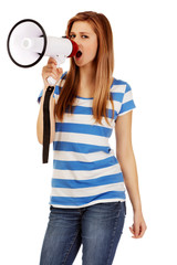 Teenage woman screaming through megaphone
