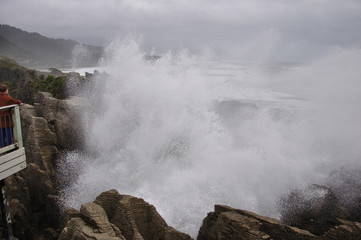 The main blowhole at Punakaiki on the West Coast of New Zealand, named Pluto, erupts with a gush of seawater at high tide.