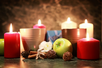 night cup of tea with candle and apple