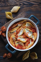 Conchiglioni with cottage cheese in a baking dish, above view