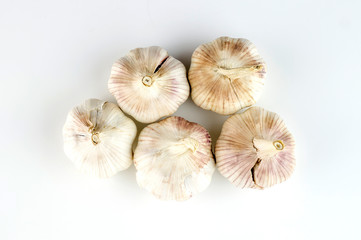 Top view of unshelled organic garlic heads