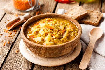 lentil soup in a wooden bowl