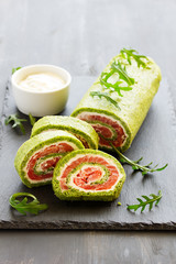 Roll salted salmon, cream cheese and spinach.