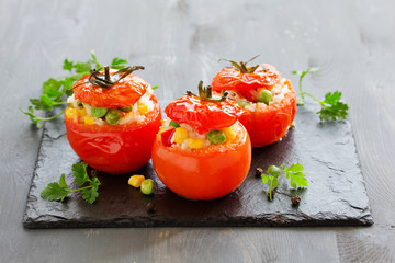 Stuffed tomatoes with rice and vegetables. Dietary appetizer