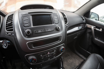 Fototapeta na wymiar Modern car interior, dashboard with monitor and music station. Fisheye view