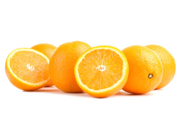 large and delicious sliced oranges laid out on a white isolated background