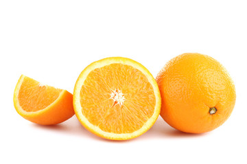 large and delicious sliced oranges laid out on a white isolated background