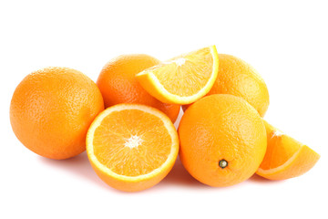 large and delicious sliced oranges laid out on a white isolated background