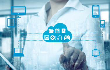 Businesswomen  touching a cloud connected to many objects on a virtual screen, concept about...