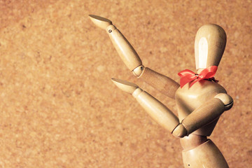 wooden figure pose present
