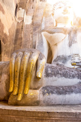 Buddha hand in a temple with morning sunlight,Sukhothai,Thailand