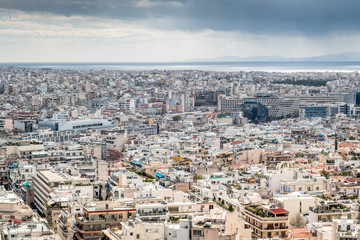 Fototapeta premium city landscape with dramatic sky, clouds and mountains 