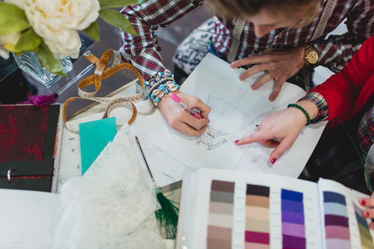 Two designers working in his workshop