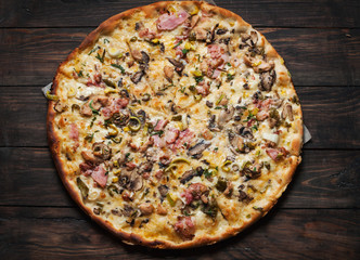 Delicious italian pizza served on wooden table