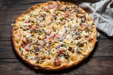Delicious italian pizza served on wooden table