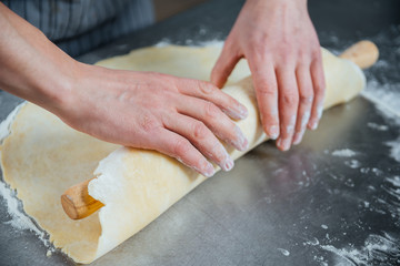 Man hands cooking and making dough using rolling pin