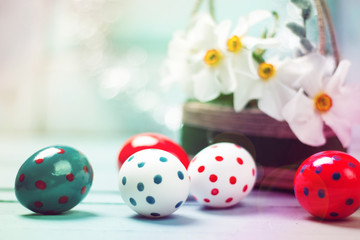 Easter concept with colored eggs on wooden background