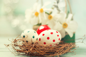 Easter concept with colored eggs on wooden background