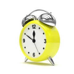 Yellow alarm clock on white