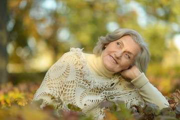 Senior woman in autumn park