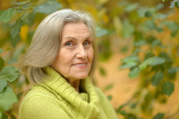 senior woman in  autumn park